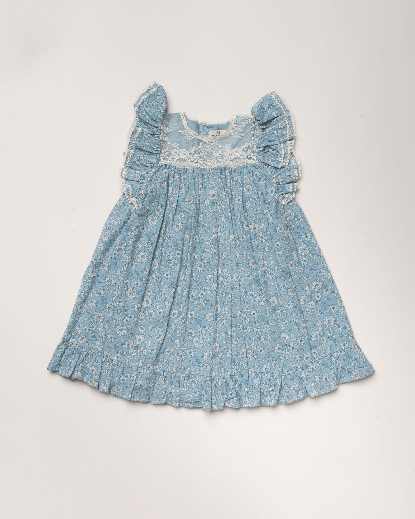 Early Sunday, Sita Dress in Tonal Floral Blue color, made from Printed Cotton Tiny Swiss Dobby fabric, featuring a sleeveless design with wide shoulder straps & a delicate lace yoke, shown in a front flat-lay view