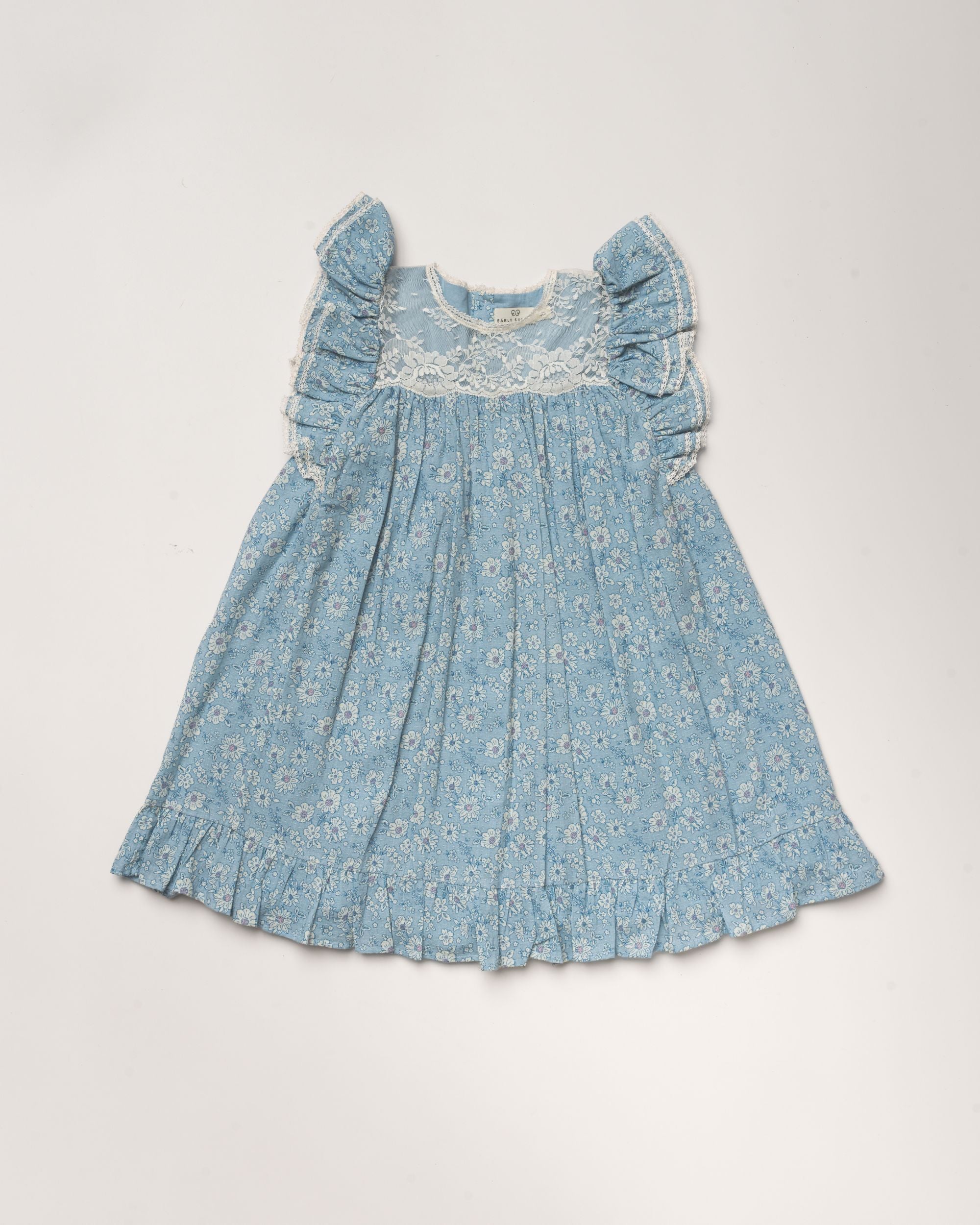 Early Sunday, Sita Dress in Tonal Floral Blue color, made from Printed Cotton Tiny Swiss Dobby fabric, featuring a sleeveless design with wide shoulder straps & a delicate lace yoke, shown in a front flat-lay view