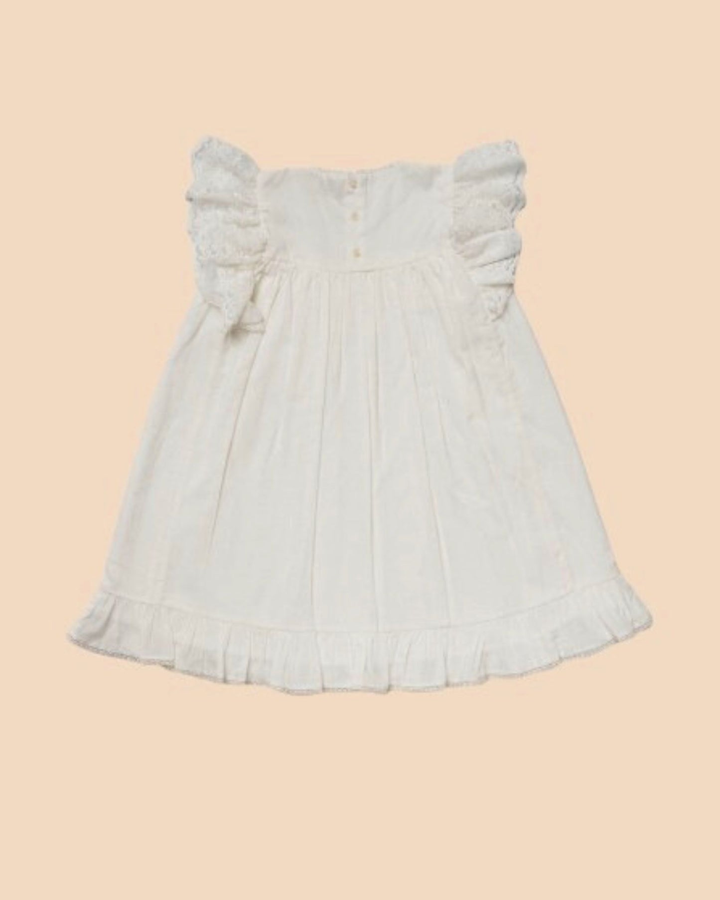 Early Sunday, Sita Dress in Ivory color, made from Tiny Swiss Dobby fabric, featuring a sleeveless design with wide shoulder straps & a delicate lace yoke, shown in a back flat-lay view