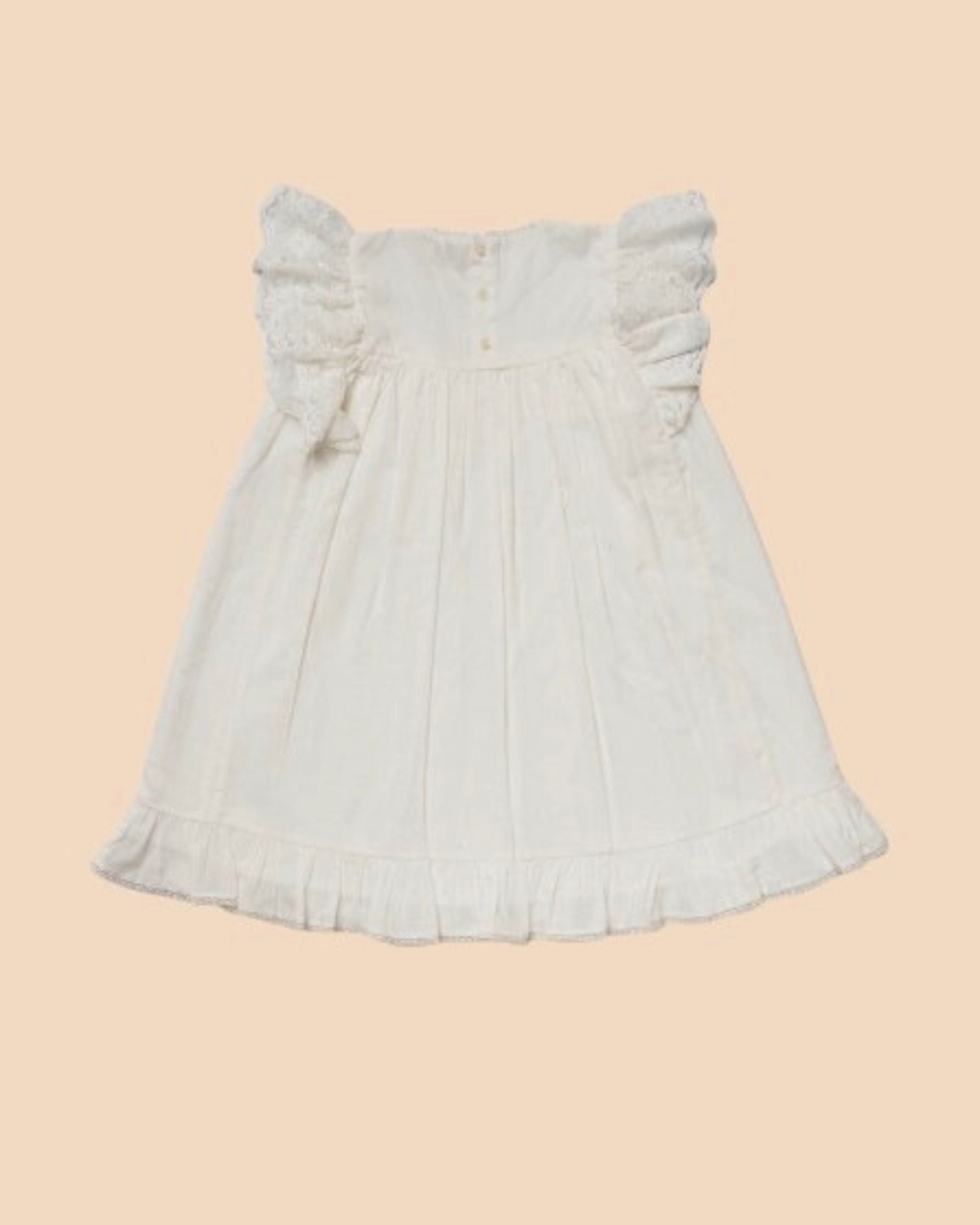 Early Sunday, Sita Dress in Ivory color, made from Tiny Swiss Dobby fabric, featuring a sleeveless design with wide shoulder straps & a delicate lace yoke, shown in a back flat-lay view