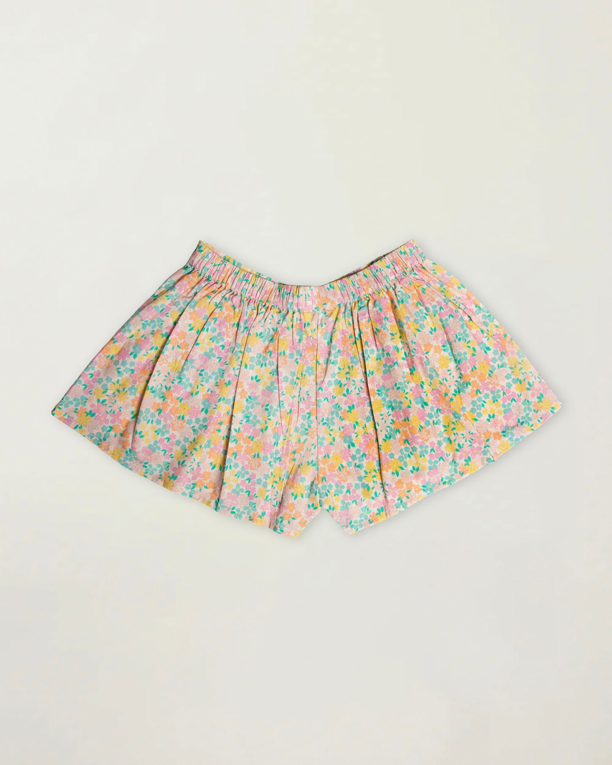 Early Sunday, Solal Skort in Emma Floral Mint color, made from Organic Printed Cotton Cambric fabric, featuring a flared skirt overlay with attached shorts & elastic waistband, shown in a back flat-lay view