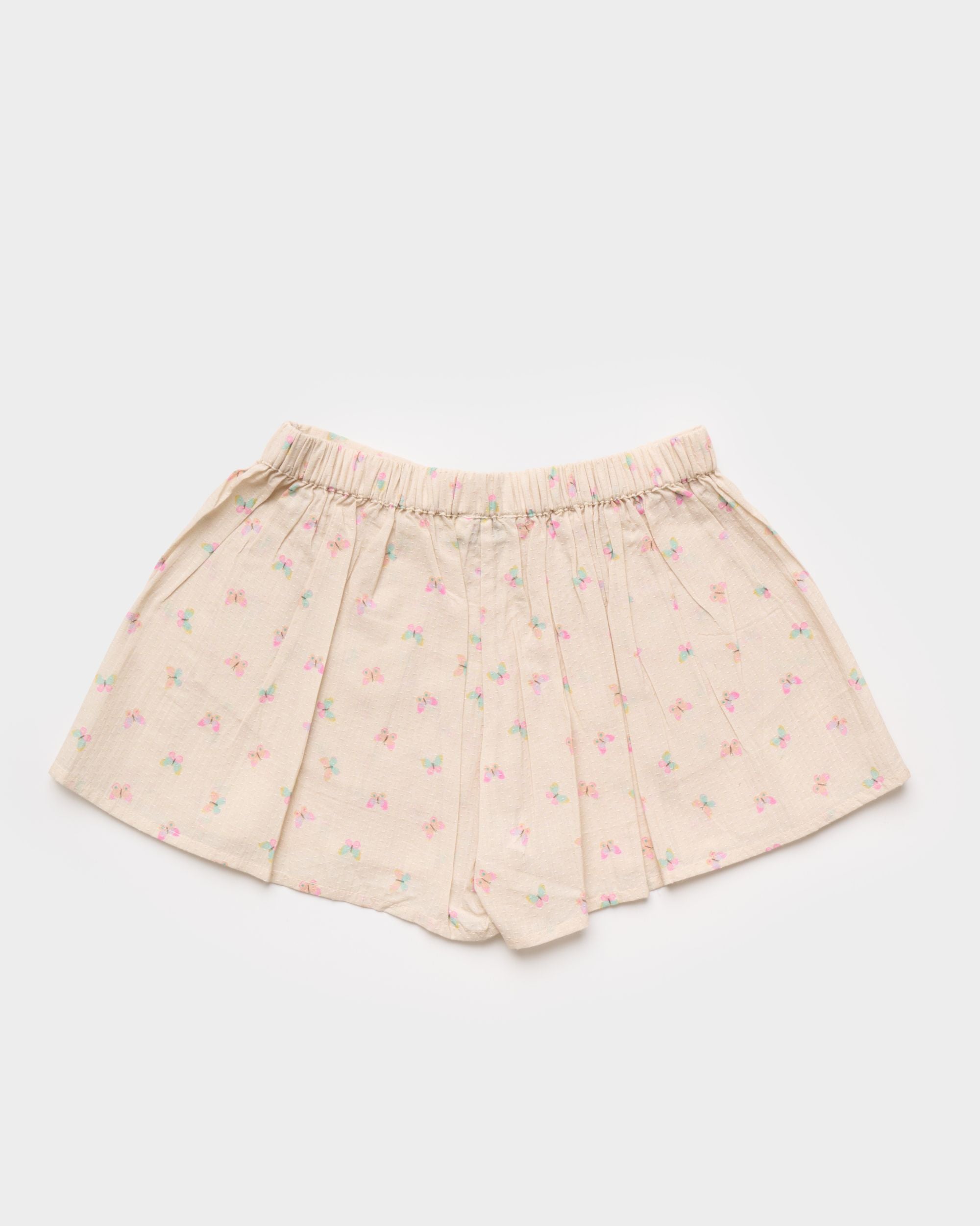 Early Sunday, Solal Skort in Butterflies print, made from Printed Cotton Tiny Swiss Dobby fabric, featuring a flared skirt overlay with attached shorts & elastic waistband, shown in a back flat-lay view
