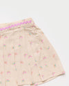 Early Sunday, Solal Skort in Butterflies print, made from Printed Cotton Tiny Swiss Dobby fabric, featuring a flared skirt overlay with attached shorts & elastic waistband, shown in a closeup flat-lay view