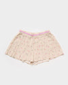 Early Sunday, Solal Skort in Butterflies print, made from Printed Cotton Tiny Swiss Dobby fabric, featuring a flared skirt overlay with attached shorts & elastic waistband, shown in a front flat-lay view