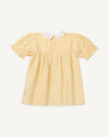 Early Sunday, Sukie Baby Dress & Bloomer in Vanilla color, made from Cotton Dobby Swiss Dots fabric, featuring flared dress with a relaxed fit for ease of movement, matching bloomer with an elasticated waistband for comfort and flexibility., shown in a back flat-lay view