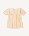 Early Sunday, Sukie Baby Dress & Bloomer in Warm Sand color, made from Cotton Seersucker fabric, featuring flared dress with a relaxed fit for ease of movement, matching bloomer with an elasticated waistband for comfort and flexibility., shown in a back flat-lay view
