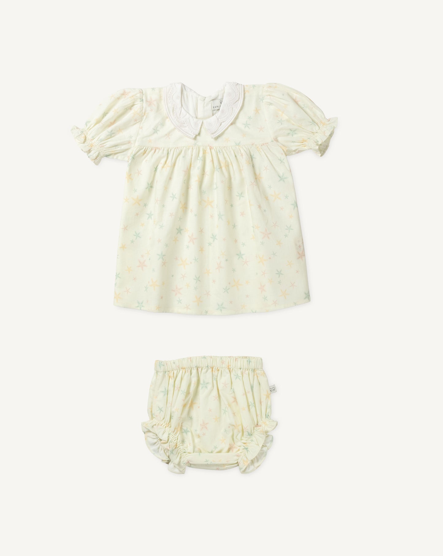 Early Sunday, Sukie Baby Dress & Bloomer in Star Fish print, made from Printed Cotton Cambric fabric, featuring flared dress with a relaxed fit for ease of movement, matching bloomer with an elasticated waistband for comfort and flexibility., shown in a front flat-lay view