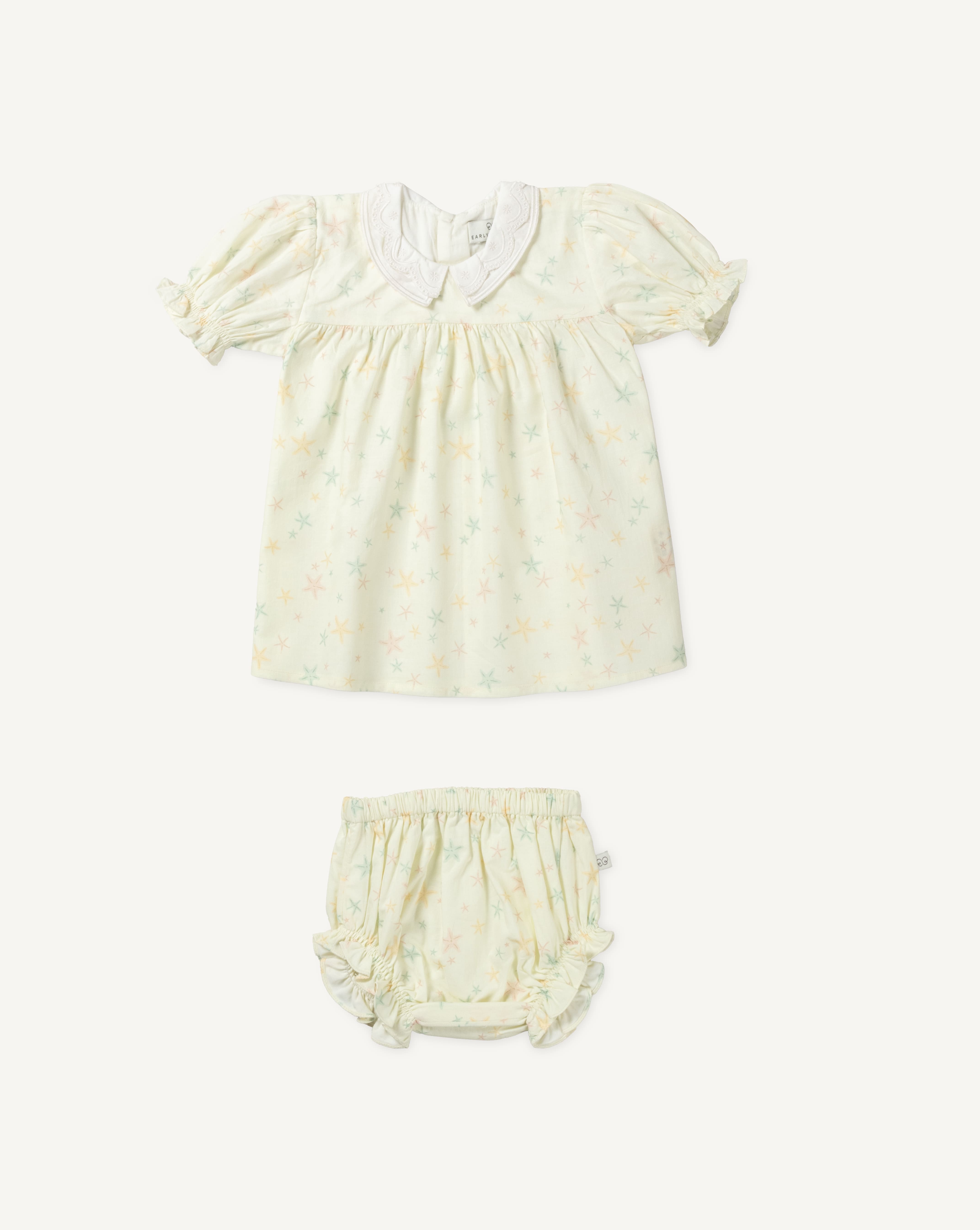 Early Sunday, Sukie Baby Dress & Bloomer in Star Fish print, made from Printed Cotton Cambric fabric, featuring flared dress with a relaxed fit for ease of movement, matching bloomer with an elasticated waistband for comfort and flexibility., shown in a front flat-lay view