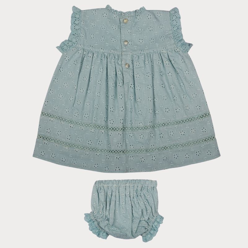 Early Sunday, Susie Baby Dress & Bloomer in Sea Dream color, made from All-Over Eyelet Embroidered Cotton Schifflie fabric, featuring flared dress with a relaxed fit for ease of movement, matching bloomer with an elasticated waistband for comfort and flexibility, shown in a back flat-lay view