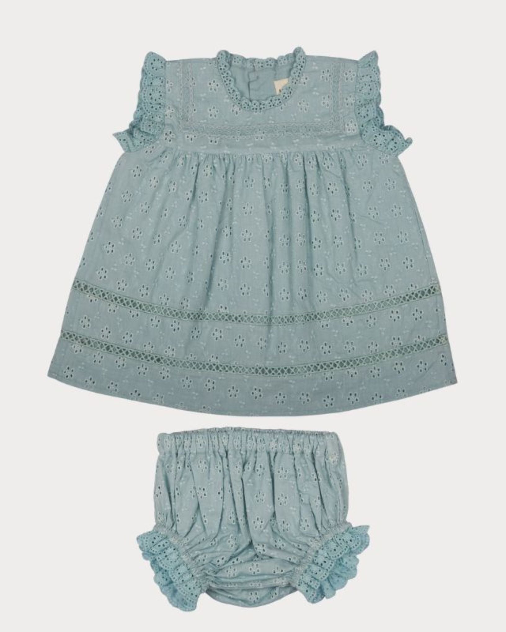 Early Sunday, Susie Baby Dress & Bloomer in Sea Dream color, made from All-Over Eyelet Embroidered Cotton Schifflie fabric, featuring flared dress with a relaxed fit for ease of movement, matching bloomer with an elasticated waistband for comfort and flexibility, shown in a front flat-lay view