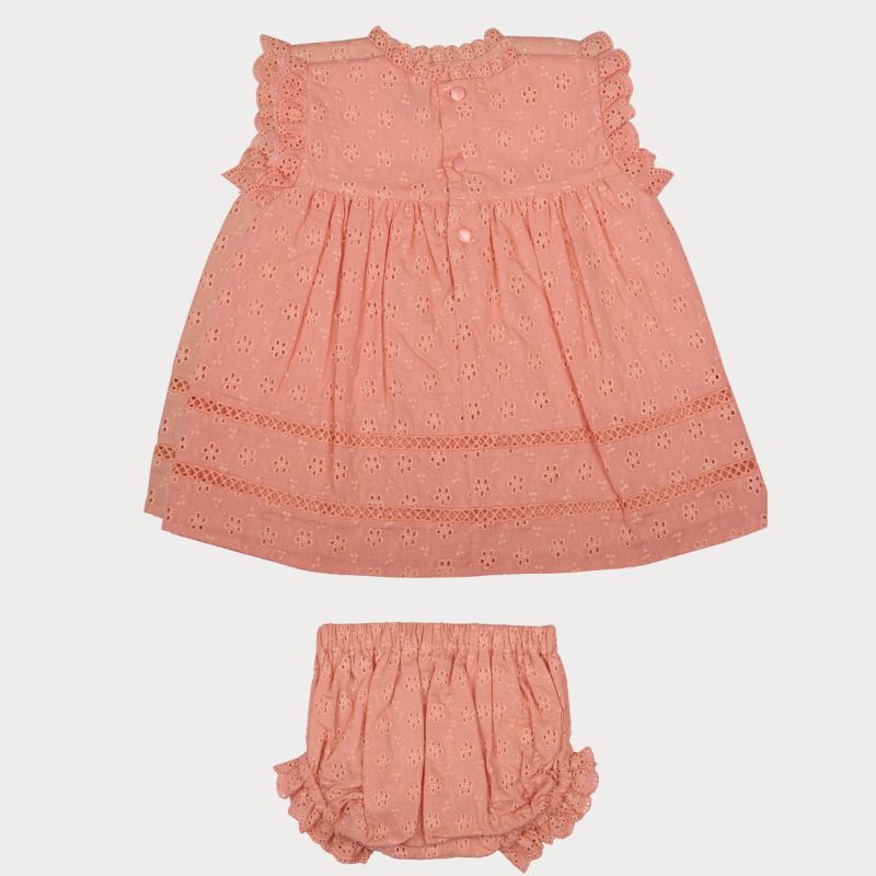Early Sunday, Susie Baby Dress & Bloomer in Strawberry color, made from All-Over Eyelet Embroidered Cotton Schifflie fabric, featuring flared dress with a relaxed fit for ease of movement, matching bloomer with an elasticated waistband for comfort and flexibility, shown in a back flat-lay view