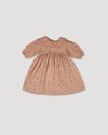 Early Sunday, Suzie Dress in Acorn Dusty Pink, made from Printed Cotton Double Gauze fabric, featuring classic silhouette with a ruffle neckline and mother-of-pearl buttons, shown in a front flat-lay view