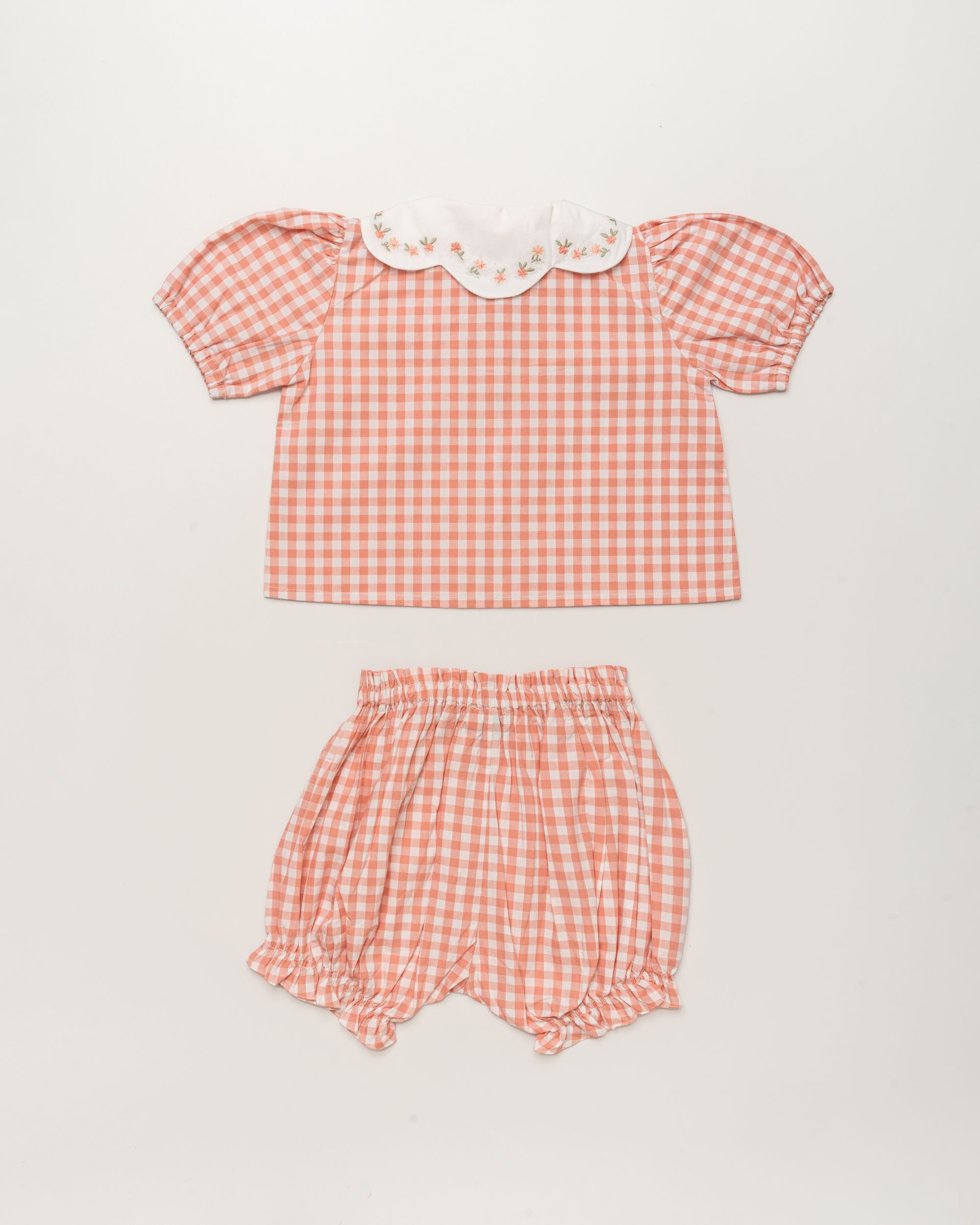 Early Sunday, Tilly Blouse & Holly Baby Shorts Set in Peony color, made from 100% Cotton Gingham Check fabric, featuring a bubble pattern with beautiful embroidery, shown in a back flat-lay view