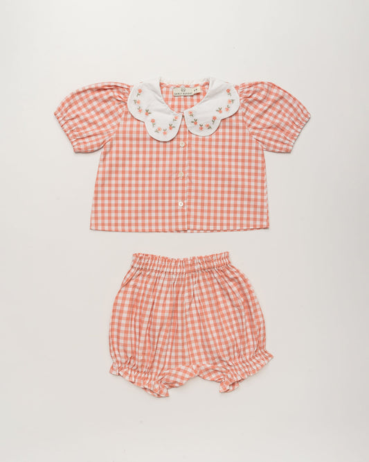 Early Sunday, Tilly Blouse & Holly Baby Shorts Set in Peony color, made from 100% Cotton Gingham Check fabric, featuring a bubble pattern with beautiful embroidery, shown in a front flat-lay view