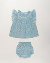 Early Sunday, Vicky Baby Dress & Bloomer Set in Tonal Floral Blue color, made from 100% Cotton Swiss Dobby Tiny Dots fabric, featuring a floral print with lace borders, shown in a front flat-lay view