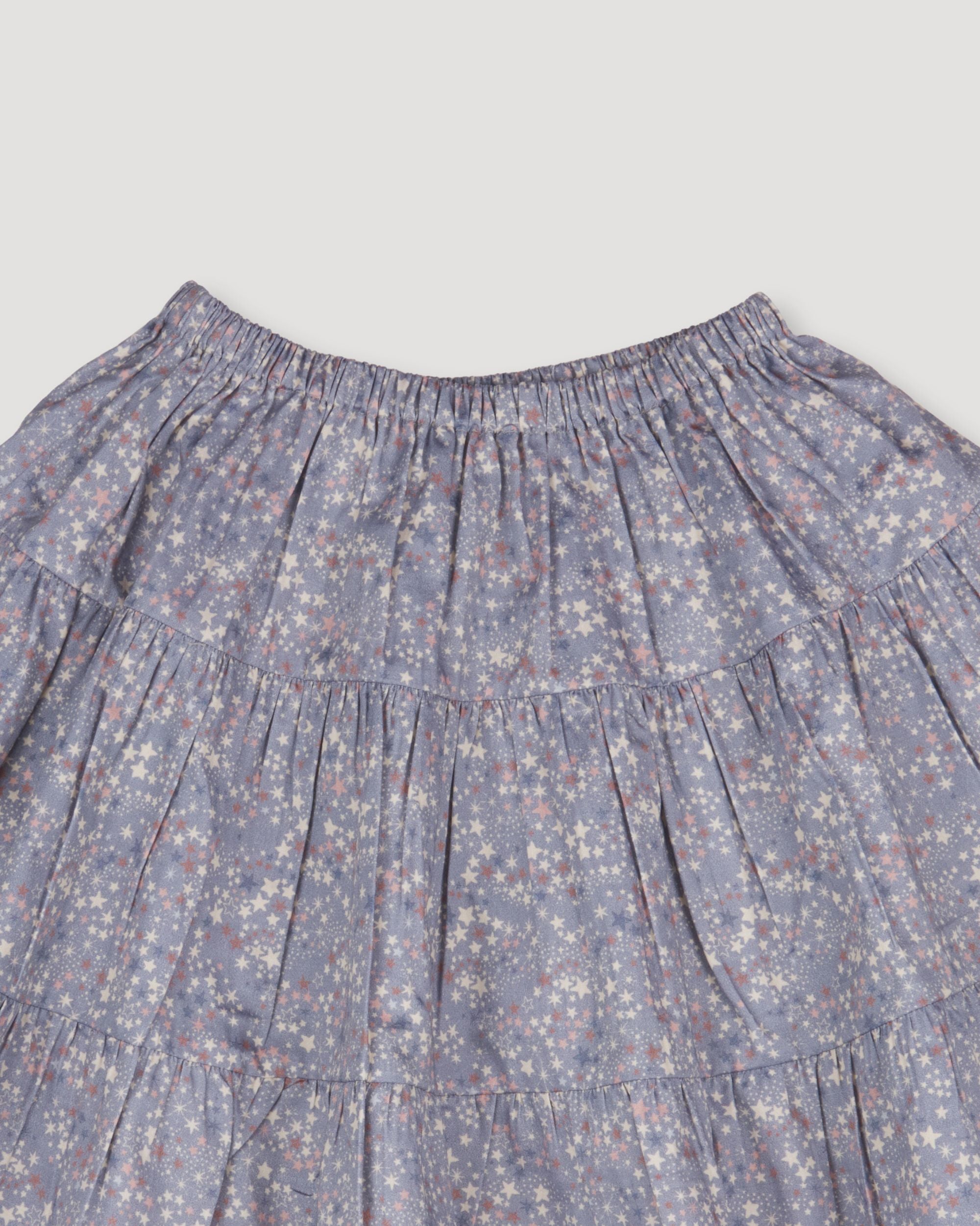 Early Sunday, Victoria Skirt in Celestial print, made from Printed Cotton Satin fabric, featuring Tiered silhouette for natural movement and volume, shown in a closeup flat-lay view