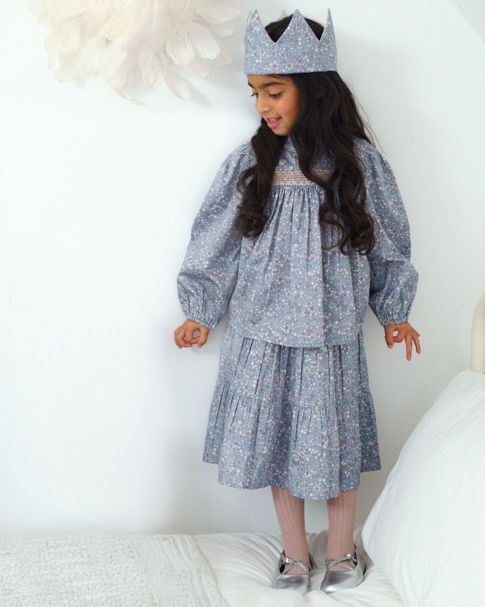 Early Sunday, Victoria Skirt in Celestial print, made from Printed Cotton Satin fabric, featuring Tiered silhouette for natural movement and volume, shown in a side view of model wearing it