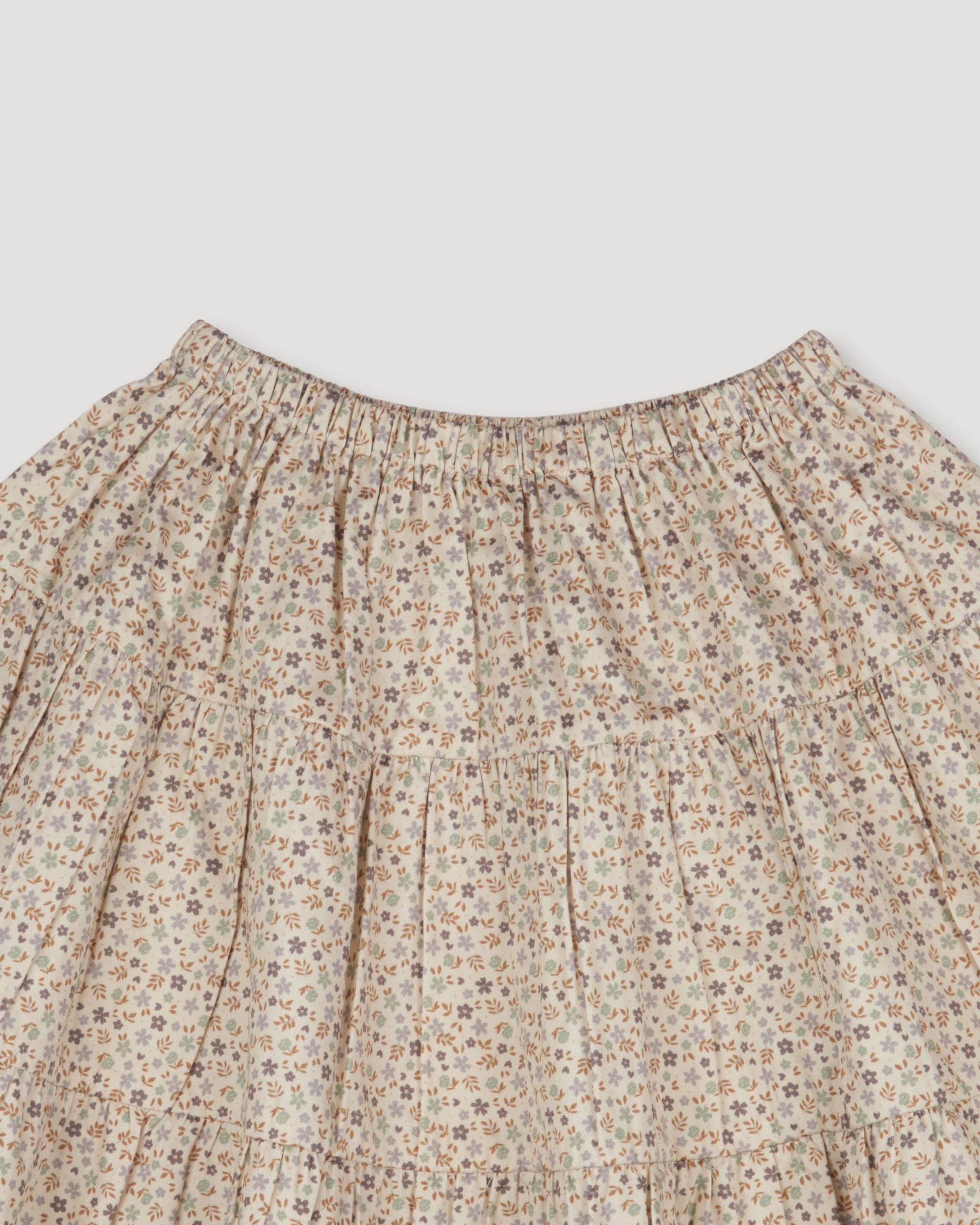 Early Sunday, Victoria Skirt in Miny Flowers print, made from Printed Cotton Satin fabric, featuring Tiered silhouette for natural movement and volume, shown in a closeup flat-lay view