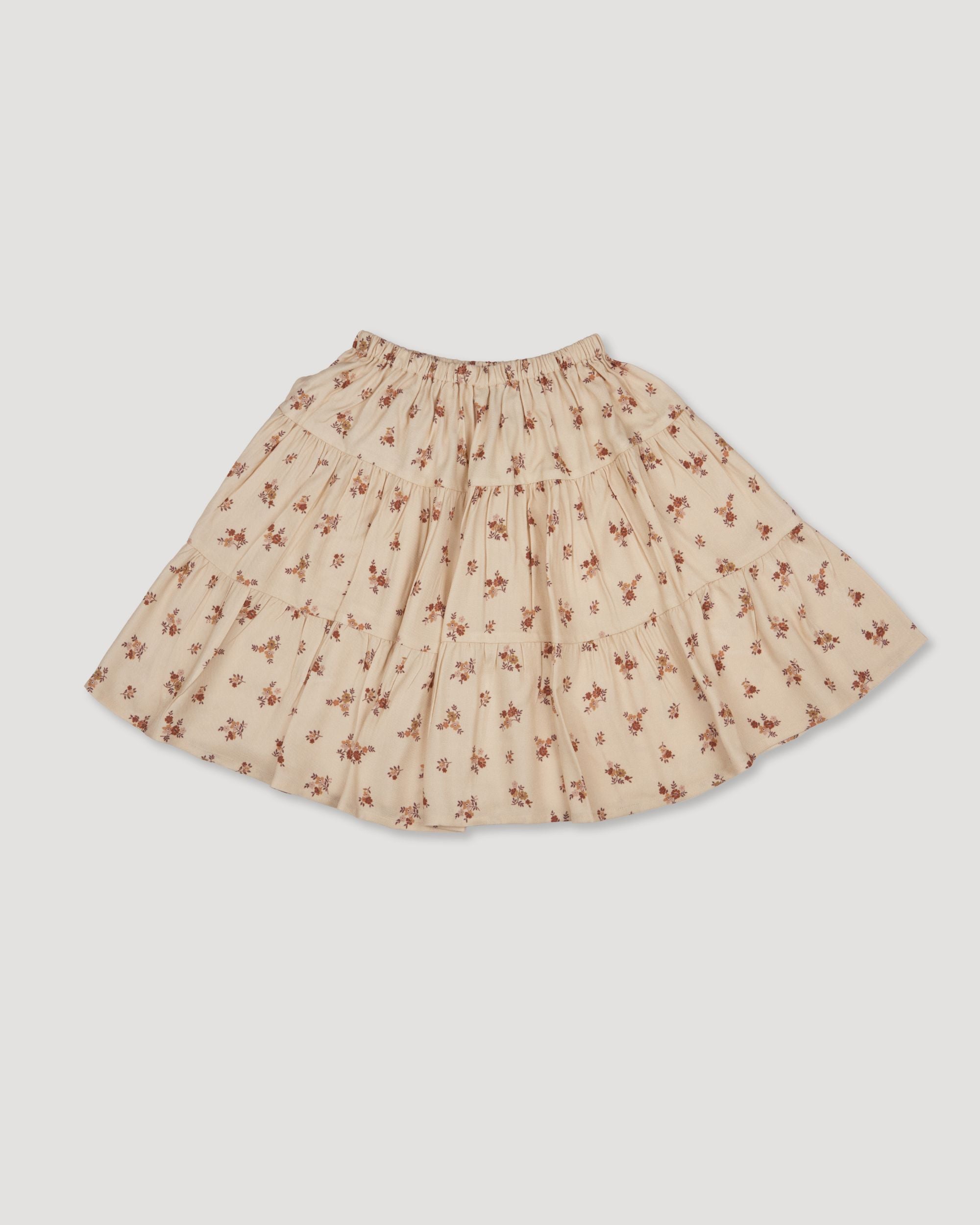 Early Sunday, Victoria Skirt in Ditsy Bouquet Cream print, made from Printed Viscose Rayon Twill fabric, featuring Tiered silhouette for natural movement and volume, shown in a front flat-lay view