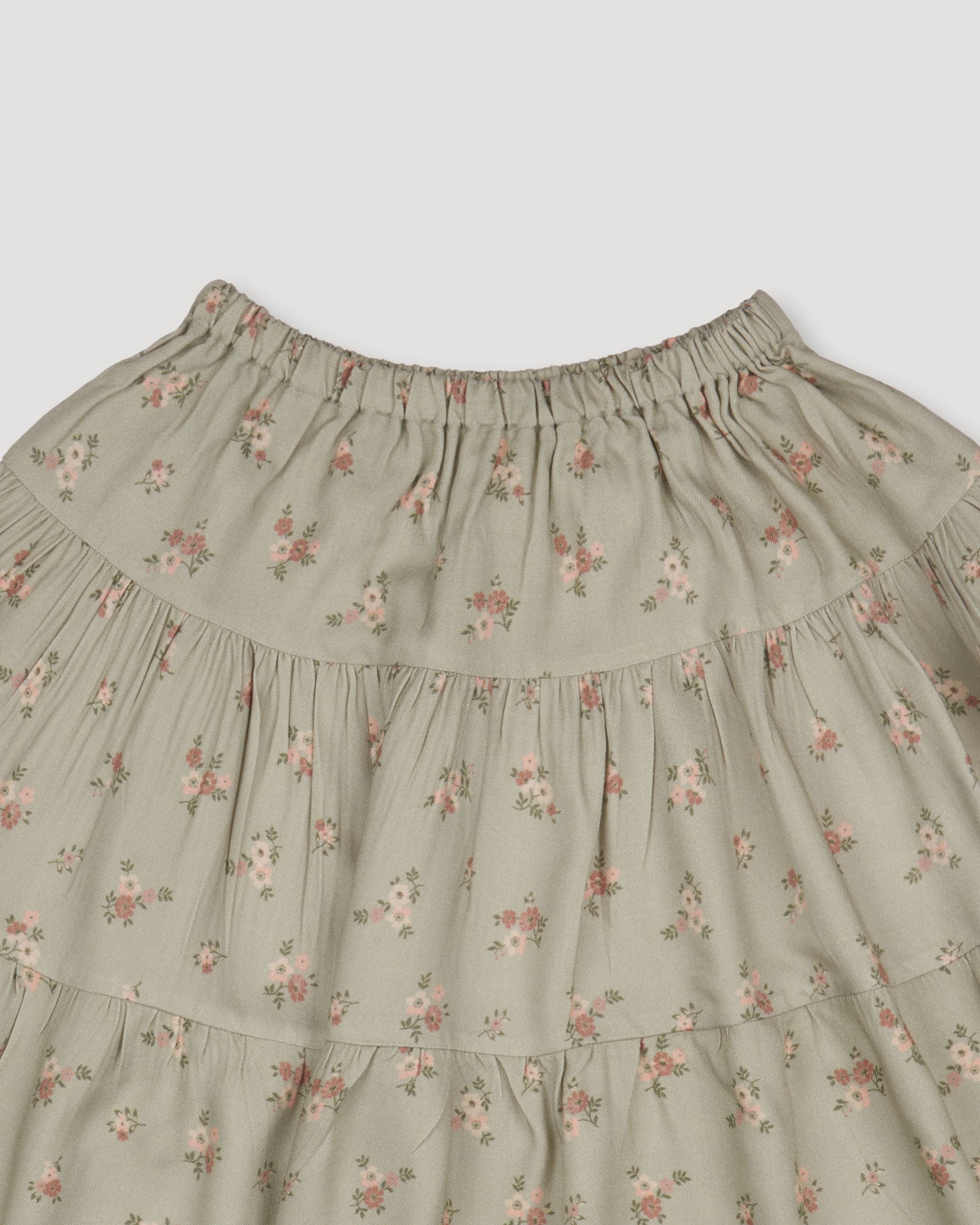 Early Sunday, Victoria Skirt in Ditsy Bouquet Jade print, made from Printed Viscose Rayon Twill fabric, featuring Tiered silhouette for natural movement and volume, shown in a closeup flat-lay view