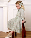 Early Sunday, Victoria Skirt in Ditsy Bouquet Jade print, made from Printed Viscose Rayon Twill fabric, featuring Tiered silhouette for natural movement and volume, shown in a side view of model wearing it
