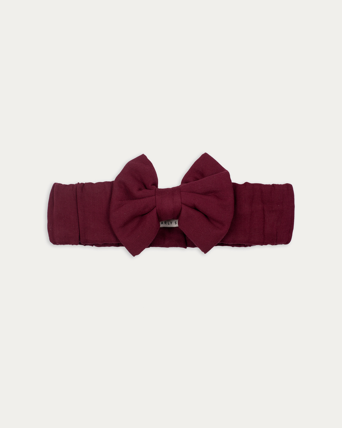 Early Sunday, Wide Bow Head Band in Plum, made from Cotton Double Gauze fabric, featuring a wide bow design, shown in a front flat-lay view