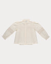 Early Sunday, Zoe Shirt in Ecru, made from Cotton Jeera Dobby Voile fabric, featuring frilled roundneck with detailed lace yoke, shown in a back flat-lay view