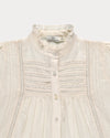 Early Sunday, Zoe Shirt in Ecru, made from Cotton Jeera Dobby Voile fabric, featuring frilled roundneck with detailed lace yoke, shown in a closeup flat-lay view