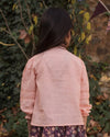 Early Sunday, Zoe Shirt in Nude, made from Cotton Jeera Dobby Voile fabric, featuring frilled roundneck with detailed lace yoke, shown in a back view of model wearing outdoors