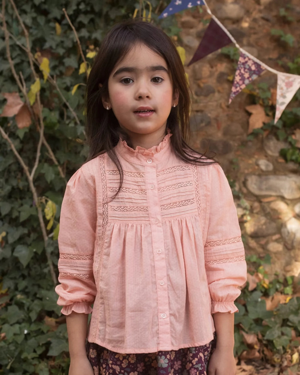 Early Sunday, Zoe Shirt in Nude, made from Cotton Jeera Dobby Voile fabric, featuring frilled roundneck with detailed lace yoke, shown in a front view of model wearing outdoors